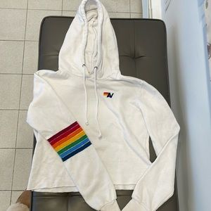 Ladie super soft Aviator Nation pullover hoodie with signature striped details.